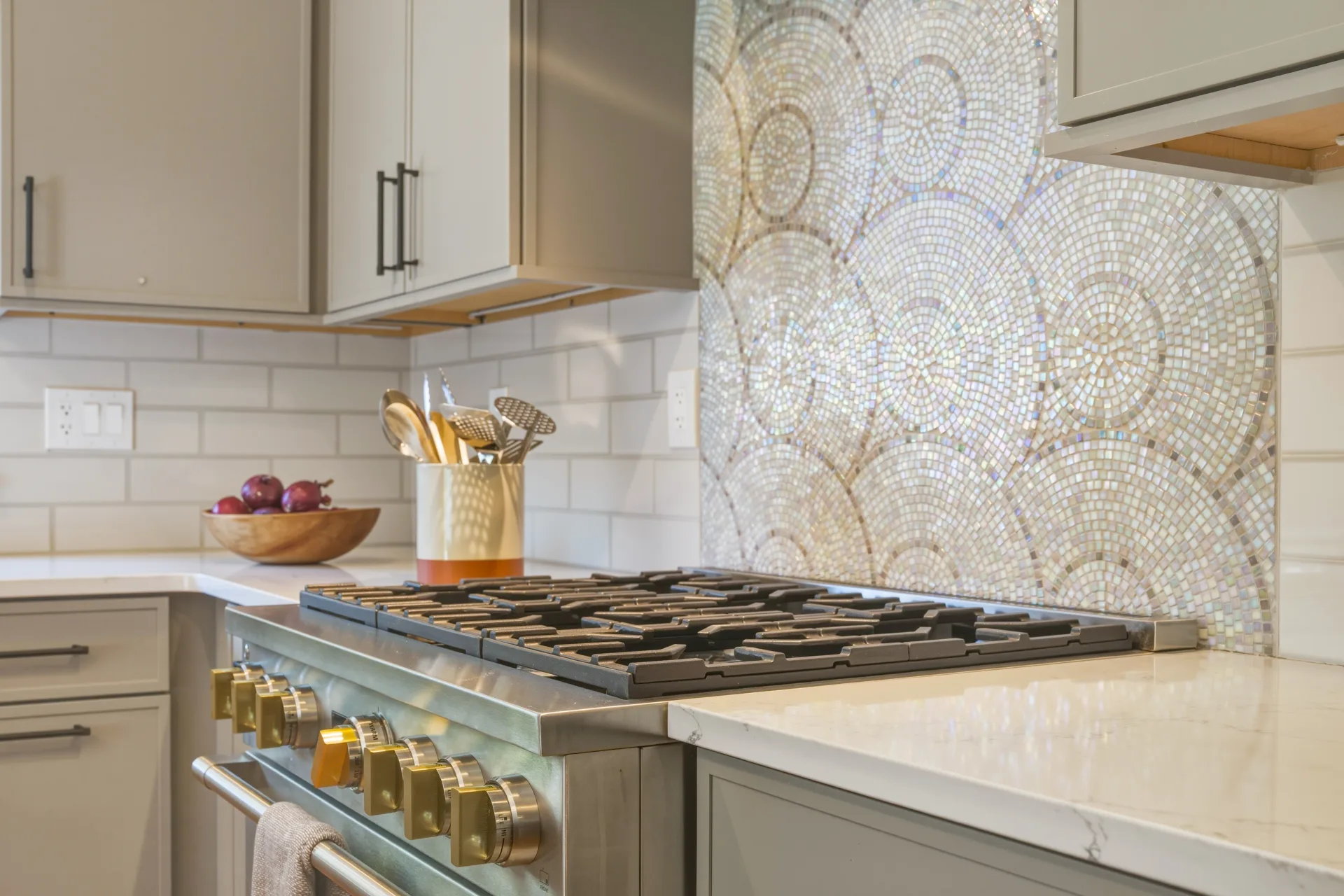 Custom kitchen range with a mosaic tile backsplash